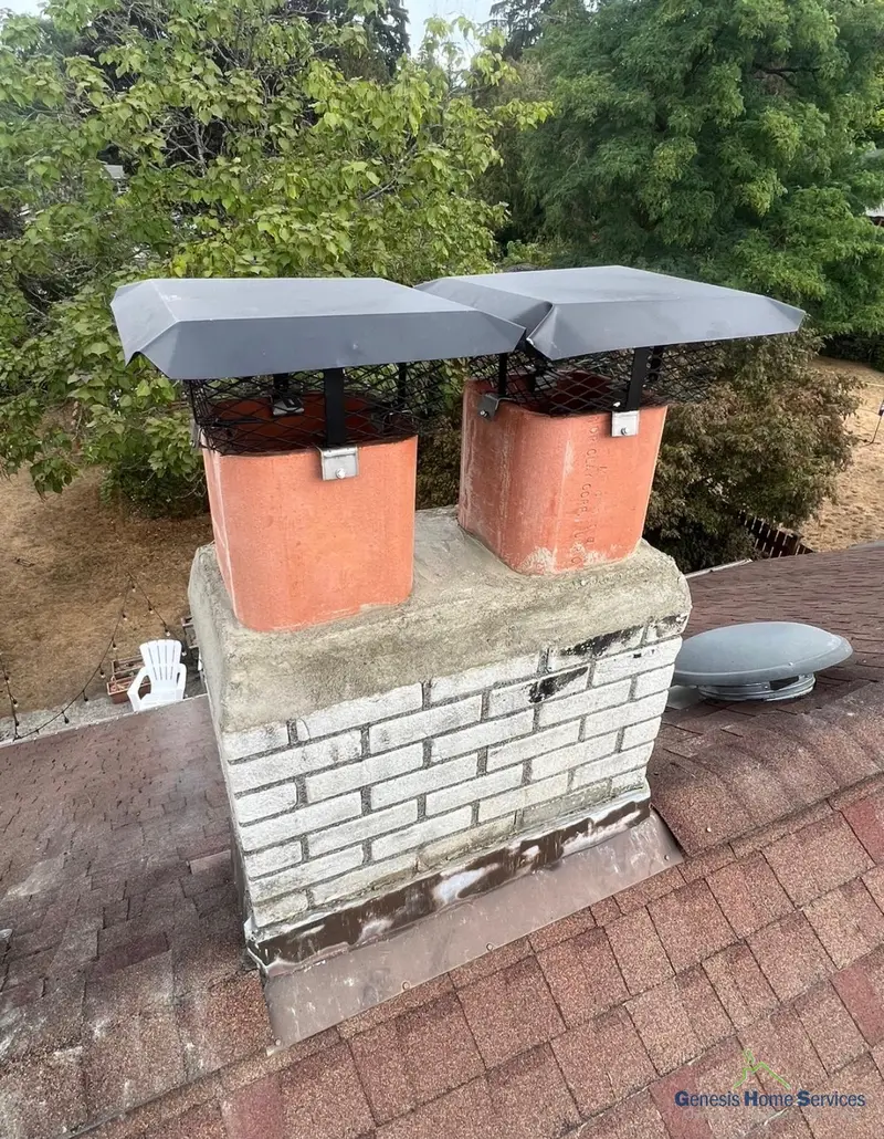Dual flue chimney cap installation on brick chimney rooftop Seattle