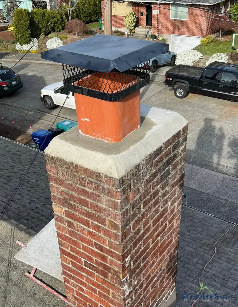 Dual flue chimney cap on waterproofed crown after installation Seattle