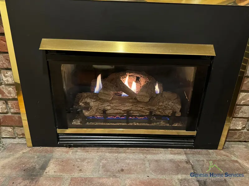 Gas fireplace brass trim black insert brick lit — Issaquah