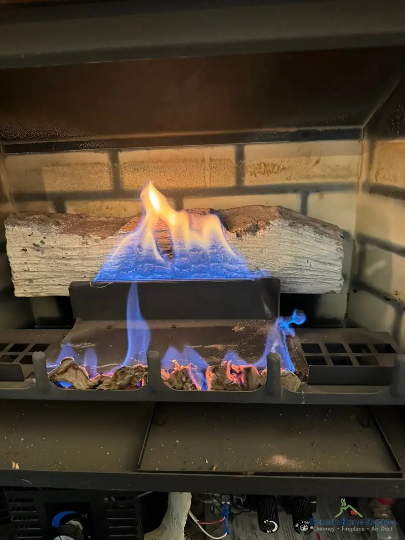 Gas fireplace burner blue flame closeup after repair Seattle