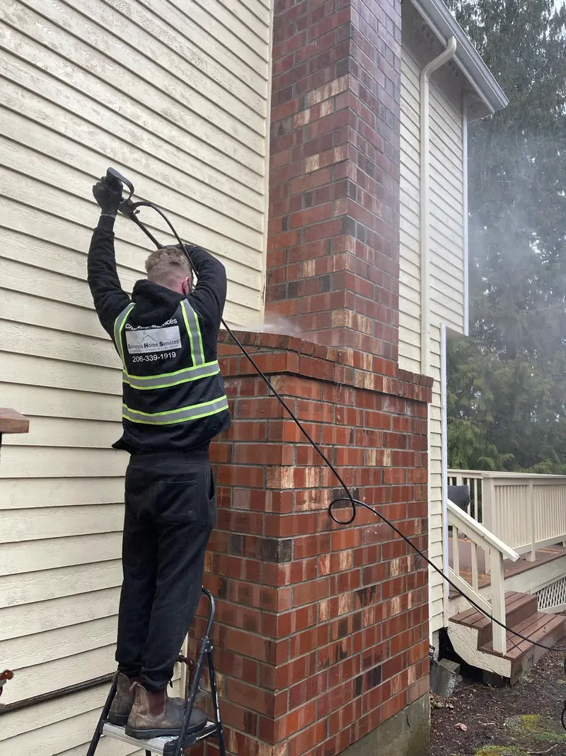 Genesis technician power cleaning a chimney Seattle WA